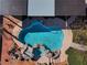 Aerial view of custom pool and spa with unique rock features, perfect for backyard relaxation at 6689 Sparks Ave, Las Vegas, NV 89142