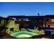 Spectacular pool with a rock waterfall and built-in spa, highlighted by a covered structure at 6689 Sparks Ave, Las Vegas, NV 89142