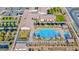 An aerial view of the community pool and recreational facilities showcases the luxurious amenities available at 697 Sunray Park St, Henderson, NV 89011