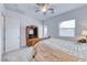 Inviting bedroom with neutral tones, carpet flooring, and plenty of natural light at 697 Sunray Park St, Henderson, NV 89011