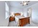 Comfortable bedroom featuring carpet floors, a ceiling fan, and neutral wall colors at 697 Sunray Park St, Henderson, NV 89011