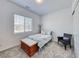 Cozy bedroom featuring a neutral palette, soft carpet, and a bright window at 697 Sunray Park St, Henderson, NV 89011