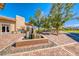 Beautiful courtyard with a charming water feature and a relaxing seating area at 697 Sunray Park St, Henderson, NV 89011