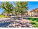 Expansive courtyard with mature trees and meticulously designed landscaping at 697 Sunray Park St, Henderson, NV 89011