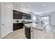 Open concept kitchen is ideal for entertaining with large quartz eat-in kitchen and stainless steel appliances at 697 Sunray Park St, Henderson, NV 89011