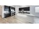 This eat-in kitchen features quartz countertops, stainless steel appliances, and gray vinyl floors at 697 Sunray Park St, Henderson, NV 89011