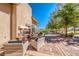 Inviting outdoor patio featuring a cozy fireplace and comfortable seating area at 697 Sunray Park St, Henderson, NV 89011