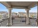 Balcony featuring decorative columns with a view of the street at 7153 Grace Estate Ave, Las Vegas, NV 89113