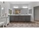 Spacious bathroom with dual sinks, modern cabinets, and a large mirror at 7153 Grace Estate Ave, Las Vegas, NV 89113