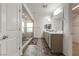 Bathroom featuring large walk-in shower, dual vanity, and contemporary design elements at 7153 Grace Estate Ave, Las Vegas, NV 89113