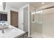 Bathroom featuring a sink and shower with glass sliding doors at 7153 Grace Estate Ave, Las Vegas, NV 89113