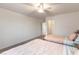 Bright bedroom with ceiling fan, two beds, and a walk-in closet at 7153 Grace Estate Ave, Las Vegas, NV 89113