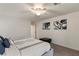 Bright bedroom featuring a king bed, ceiling fan and abstract artwork at 7153 Grace Estate Ave, Las Vegas, NV 89113