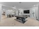 Spacious living room features a modern fireplace, a sleek pool table, and abundant natural light at 7153 Grace Estate Ave, Las Vegas, NV 89113