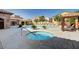 Resort-style pool and hot tub area with ample seating, perfect for relaxing and enjoying the community amenities at 7253 Sterling Rock Ave, Las Vegas, NV 89178