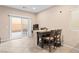 Bright dining area with a sliding door to the backyard at 7253 Sterling Rock Ave, Las Vegas, NV 89178