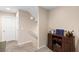 Hallway landing features a staircase, carpet, and a dry bar with a wine rack at 7253 Sterling Rock Ave, Las Vegas, NV 89178