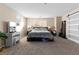 Spacious main bedroom with carpet flooring features large windows and a vanity at 7253 Sterling Rock Ave, Las Vegas, NV 89178