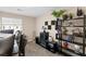 Home office featuring a large desk with built-in shelves, a mini fridge, and a window at 7253 Sterling Rock Ave, Las Vegas, NV 89178