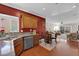 Bright kitchen with stainless steel appliances and adjacent dining area in open floor plan at 7633 Lily Trotter St, North Las Vegas, NV 89084