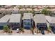 Aerial view of a neighborhood showcasing well-maintained homes with tile roofs and landscaping at 7665 Sandhaven St, Las Vegas, NV 89139