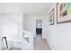 Upstairs hallway with neutral colors and views of the living room at 7665 Sandhaven St, Las Vegas, NV 89139