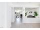 An open hallway leads to the modern living areas, showcasing the seamless design of the home at 7665 Sandhaven St, Las Vegas, NV 89139