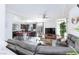 Open concept living room flows into eat-in kitchen with granite counters and stainless appliances at 7665 Sandhaven St, Las Vegas, NV 89139