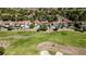 Aerial view of luxurious homes bordering the well-manicured golf course, offering a serene and picturesque setting at 7999 Pinnacle Peak Ave, Las Vegas, NV 89113