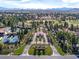 Expansive aerial view of a community showcasing landscaping, golf course and tennis courts at 7999 Pinnacle Peak Ave, Las Vegas, NV 89113