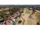 Panoramic aerial showing homes near golf course with pond and city views at 7999 Pinnacle Peak Ave, Las Vegas, NV 89113