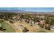 Expansive aerial view showcases the community, golf course, and the surrounding mountain landscape at 7999 Pinnacle Peak Ave, Las Vegas, NV 89113