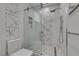 Modern bathroom features glass shower with decorative tile and mosaic floor at 7999 Pinnacle Peak Ave, Las Vegas, NV 89113