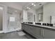 Modern bathroom featuring glass shower and dual sinks at 7999 Pinnacle Peak Ave, Las Vegas, NV 89113