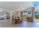 Open concept dining area with modern lighting fixtures and outdoor views at 7999 Pinnacle Peak Ave, Las Vegas, NV 89113