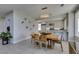 Modern dining room with wood table and view to kitchen at 7999 Pinnacle Peak Ave, Las Vegas, NV 89113
