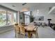 Open dining area with a live-edge wood table and view to living room and pool at 7999 Pinnacle Peak Ave, Las Vegas, NV 89113