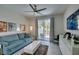 Comfortable living room with modern decor, a large flat-screen TV, and access to the patio at 7999 Pinnacle Peak Ave, Las Vegas, NV 89113
