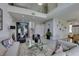 Open-concept living area with views to the dining and kitchen at 7999 Pinnacle Peak Ave, Las Vegas, NV 89113