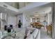 Living area with high ceilings and open staircase near the dining and kitchen at 7999 Pinnacle Peak Ave, Las Vegas, NV 89113