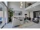 Bright, open living room with two-story ceilings and lots of natural light at 7999 Pinnacle Peak Ave, Las Vegas, NV 89113