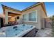 Backyard with a hot tub, covered patio and manicured plants at 8144 Skye Dragon St, Las Vegas, NV 89166