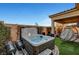 Backyard with a hot tub, outdoor seating and manicured plants at 8144 Skye Dragon St, Las Vegas, NV 89166