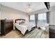 Bedroom with neutral colored walls, decorative curtains, and a ceiling fan at 8144 Skye Dragon St, Las Vegas, NV 89166