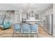 Modern eat-in kitchen featuring stainless steel appliances, white cabinets, and elegant pendant lighting at 8144 Skye Dragon St, Las Vegas, NV 89166