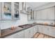 Close-up of the kitchen with stainless steel stove, gray cabinets and white subway tile backsplash at 8144 Skye Dragon St, Las Vegas, NV 89166