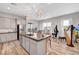 Spacious kitchen featuring a large island, stainless steel appliances, and designer light fixtures at 8144 Skye Dragon St, Las Vegas, NV 89166