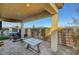 Covered patio with dining table and hanging chair at 8144 Skye Dragon St, Las Vegas, NV 89166