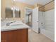 Bathroom featuring double sinks and a shower-tub combination at 8683 Bella Jewel Ave, Las Vegas, NV 89178