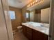 A cozy bathroom with a vanity, toilet, and shower/tub combo at 8683 Bella Jewel Ave, Las Vegas, NV 89178